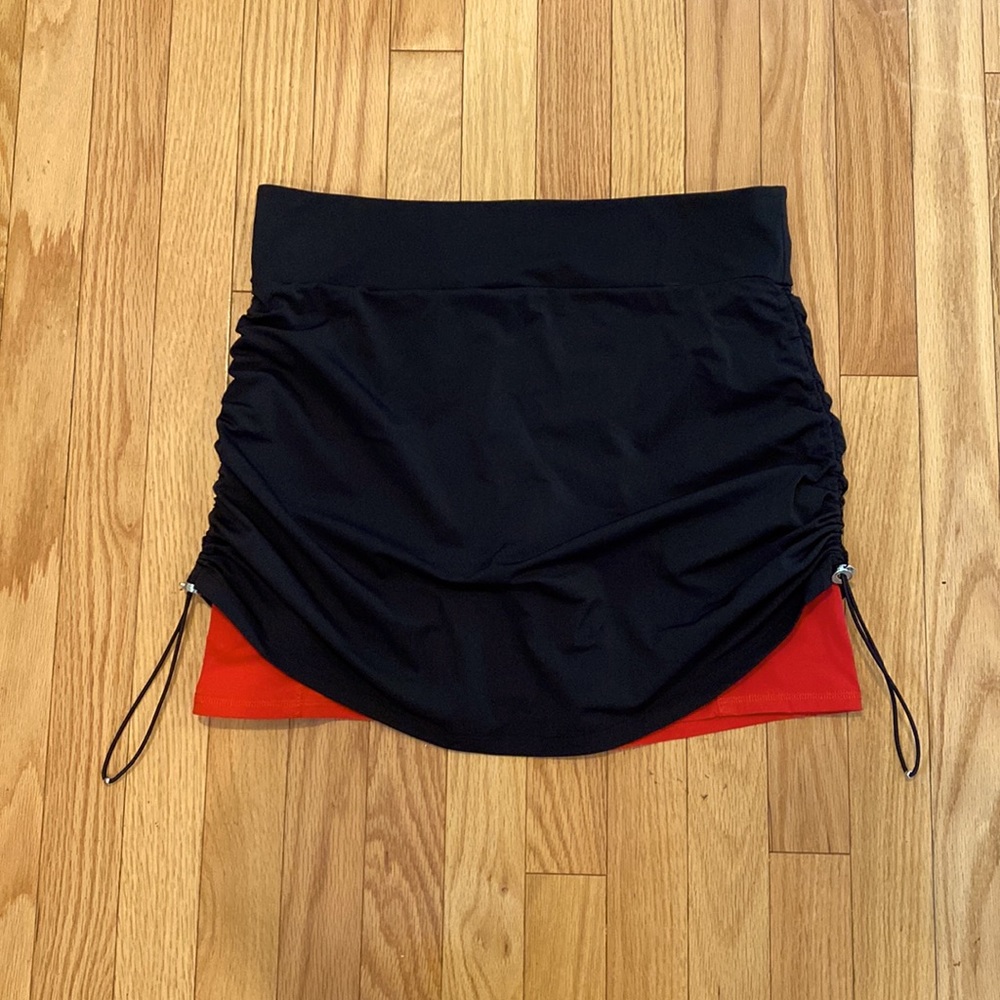 Skirt Skort with side scrunch and deep red-coral compression shorts